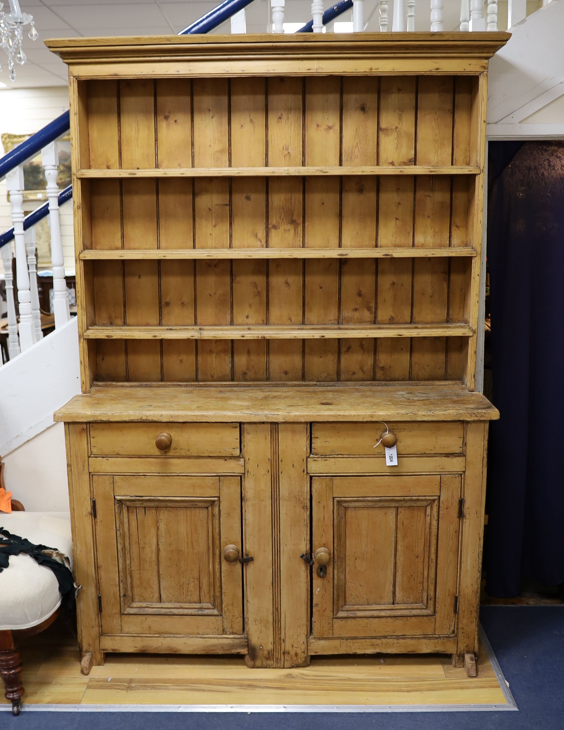 An early 19th century pine dresser, length 142cm, depth 43cm, height 208cm